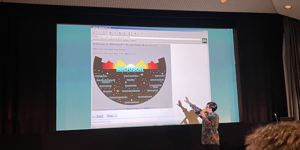 Image map navigation. Microsoft in neon blue letters atop a black half circle with stars. Different areas of the image link to destinations such as 'Microsoft TV', 'ftp.microsoft.com' and 'Facts about the server'.